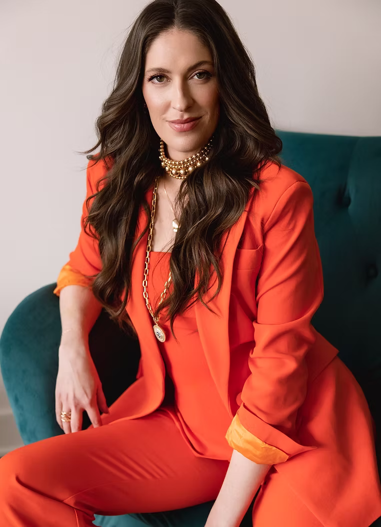 Styling client in a bright orange suit