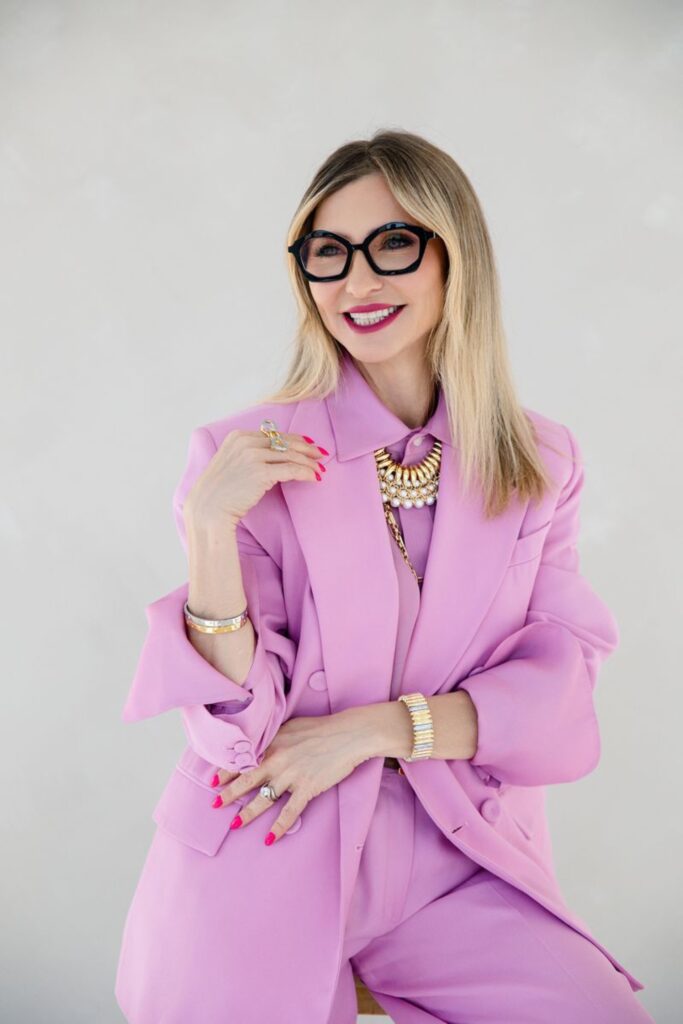 Styling client in a lilac suit and statement glasses